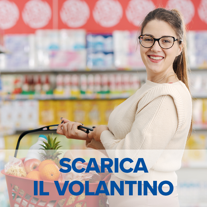 Happy customer holding a shopping basket at the grocery store